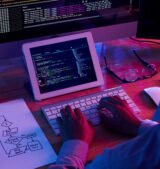 Programmer working at IT company office late at night